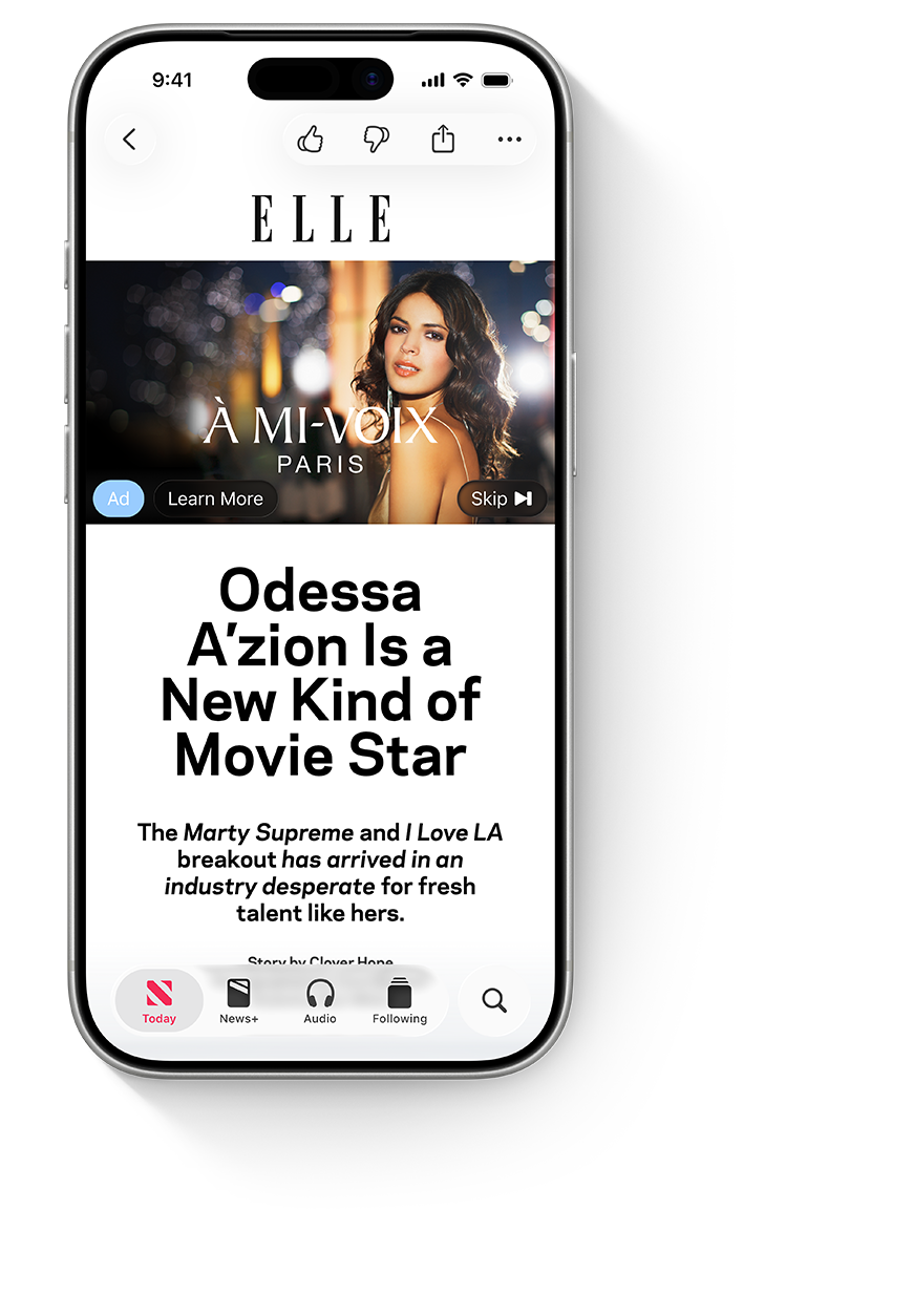 An iPhone with the Apple News app open, showing a video ad for the example couture brand Á Mi-Voix above an Elle article about movie star, Odessa A’zion.