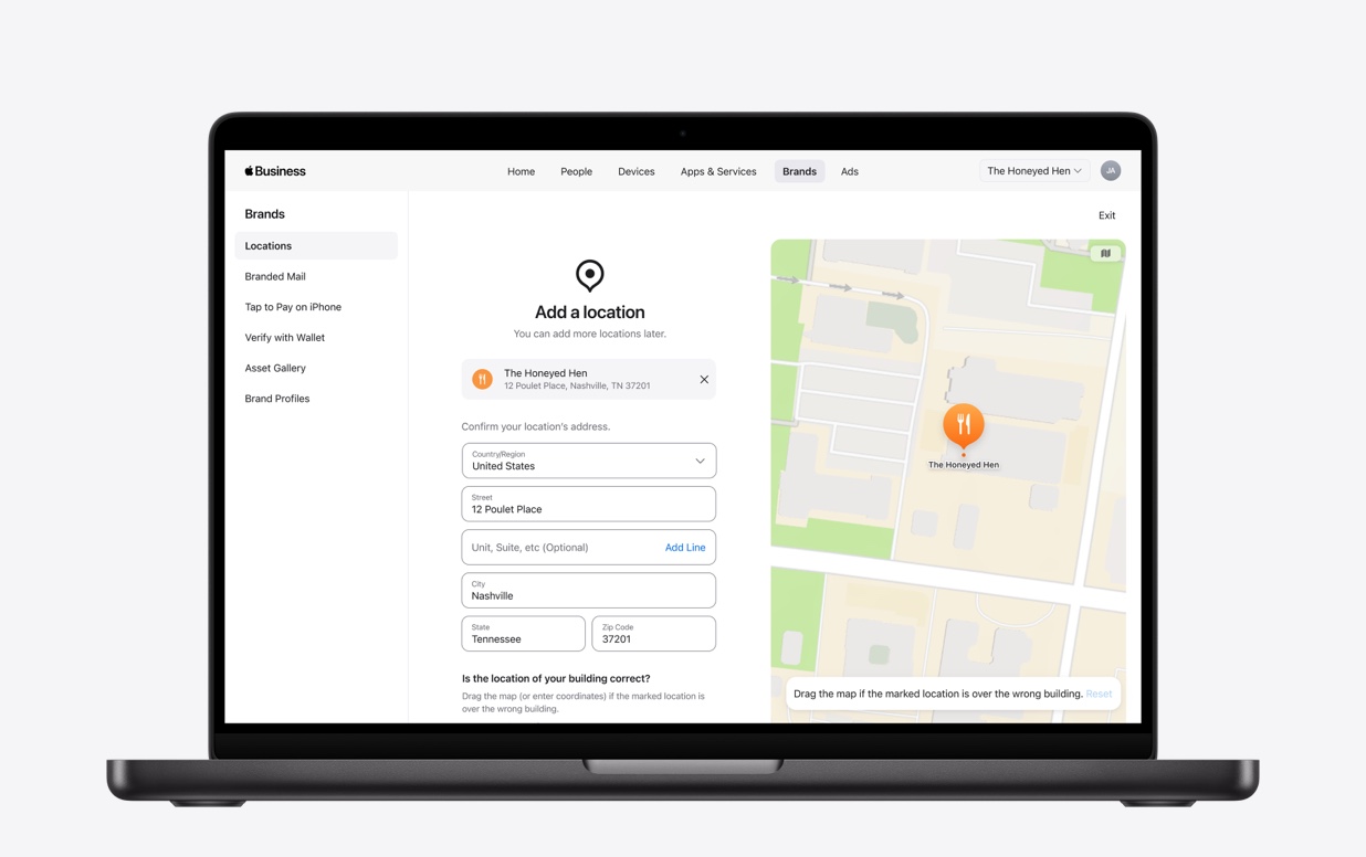 MacBook, screen shows a web application with an Add a location form and map interface.