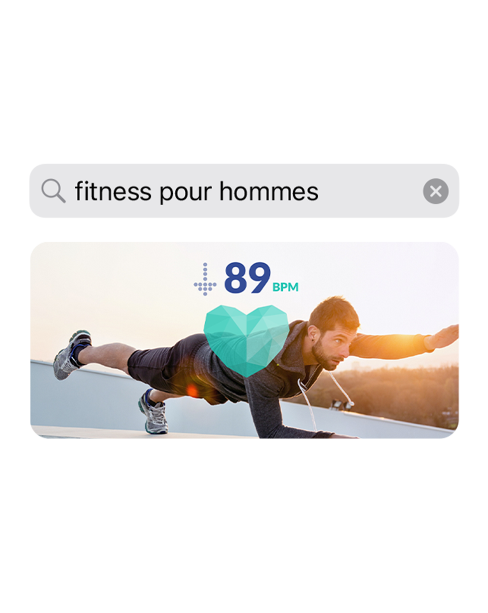 Capture d’écran d’une app affichant la requête de recherche « fitness pour homme », au-dessus d’une image montrant un homme faisant de l’exercice.