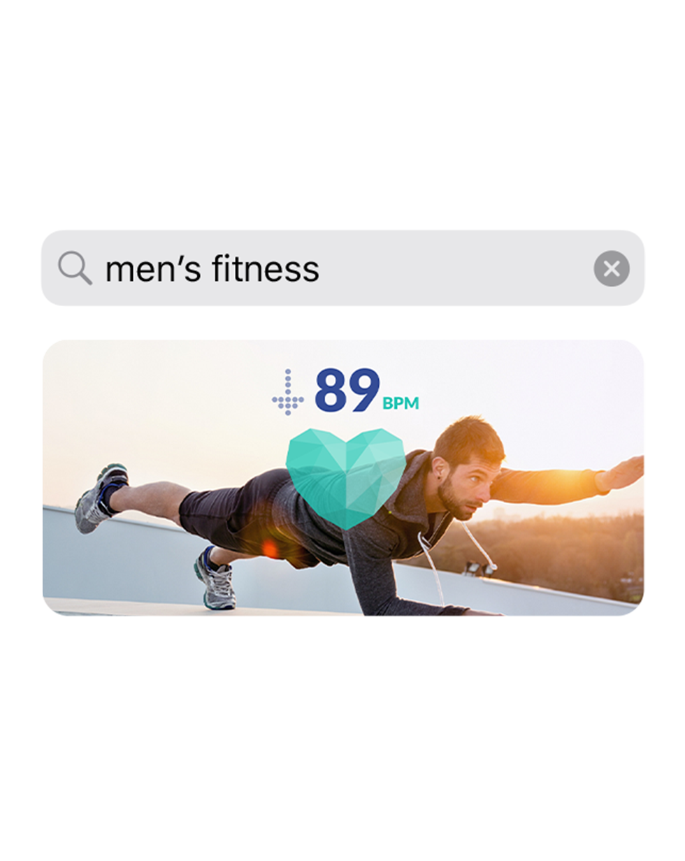 An app screenshot showing the search query "men's fitness" with an image of a man exercising below it.